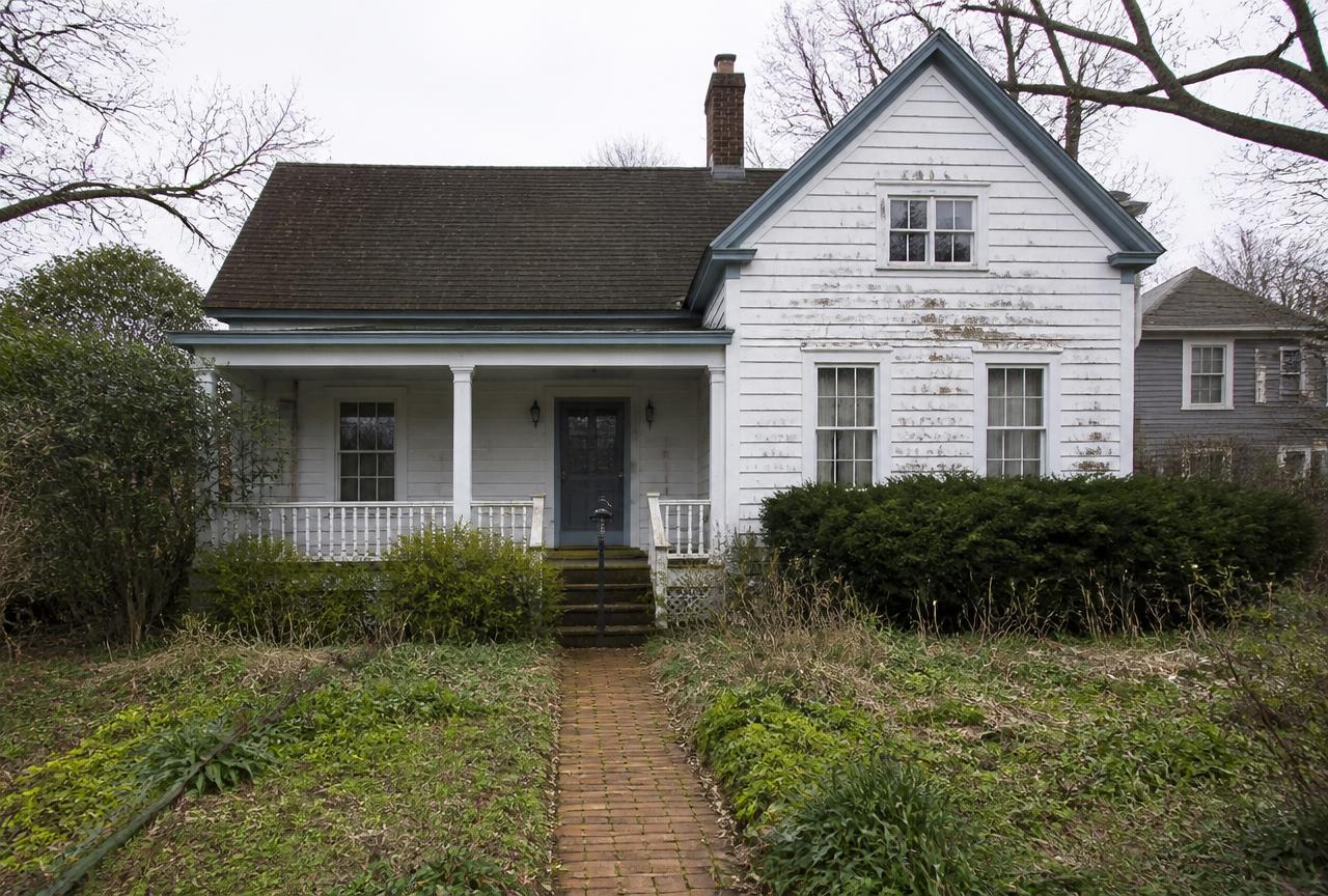 A worn Hampton Roads house that needs repairs, the kind Lee Real Estate Service buys as-is